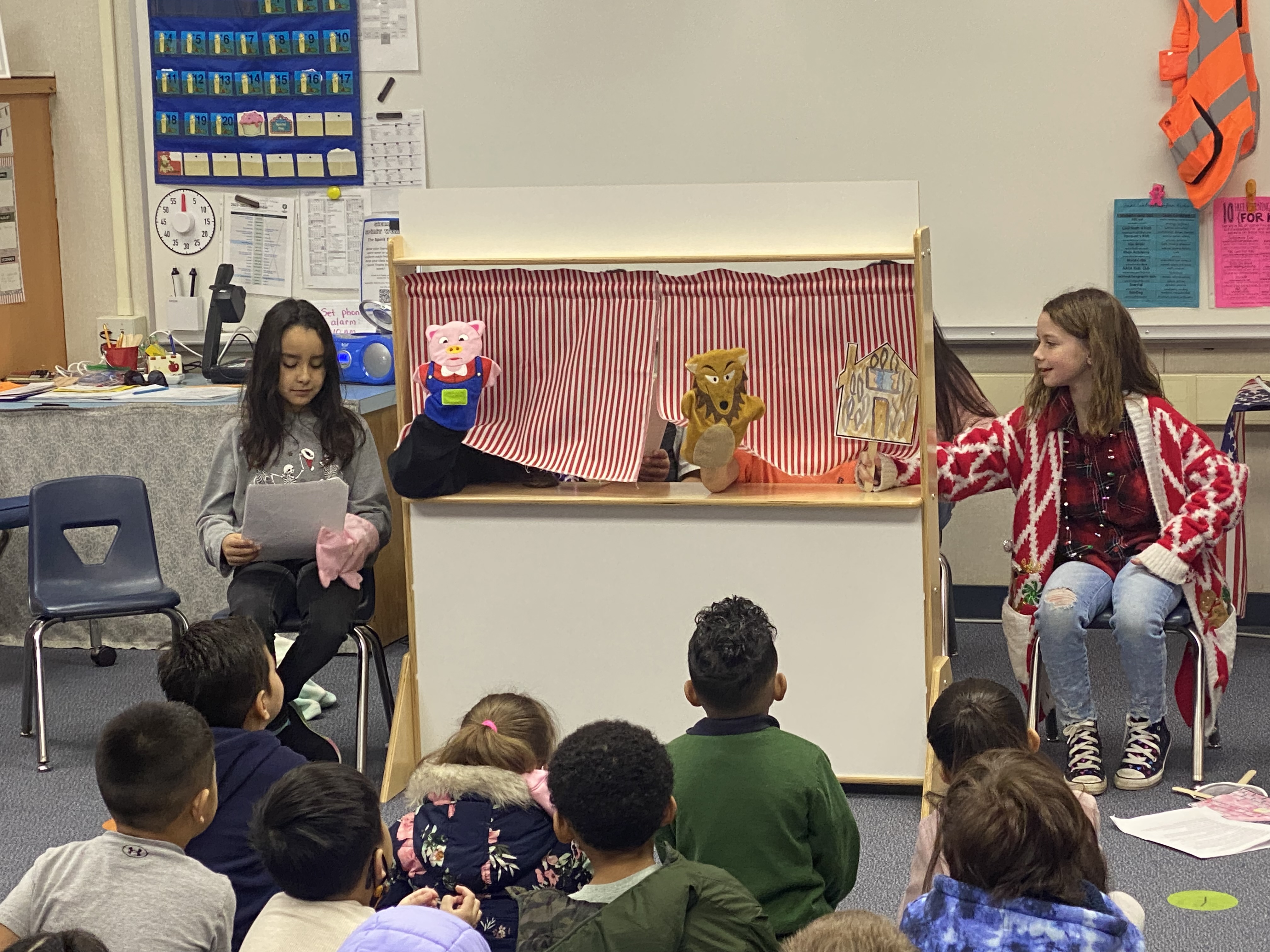 Students watching a puppet show